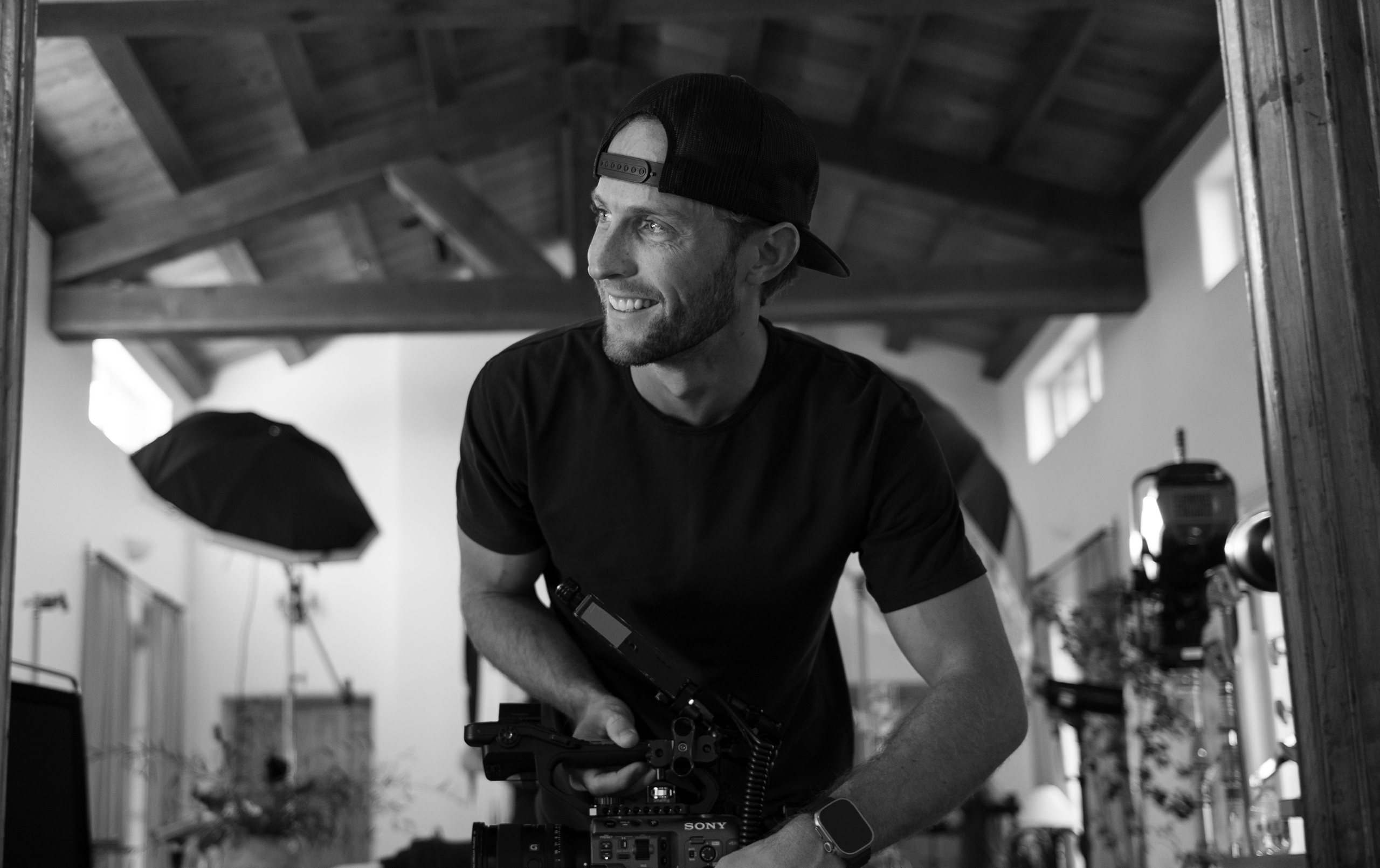 Reese Reissig with a cinema camera on set